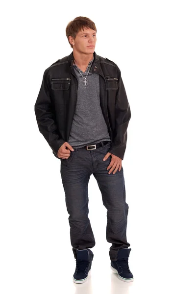 Mann in Jeans und Lederjacke. Studioaufnahme über Weiß. — Stockfoto