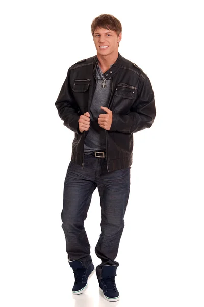 Man in jeans and leather jacket. Studio shot over white. — Stock Photo, Image