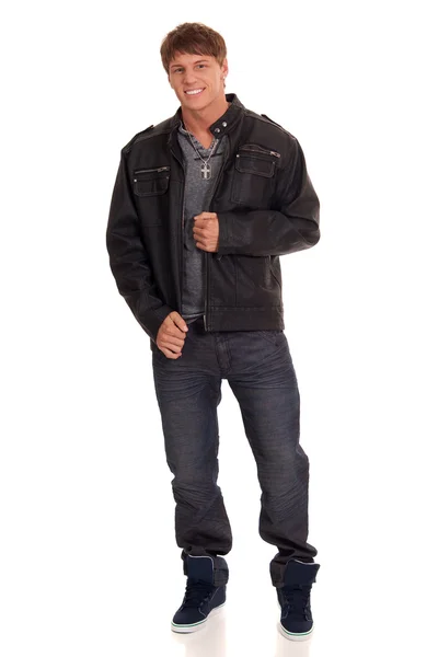 Man in jeans and leather jacket. Studio shot over white. — Stock Photo, Image