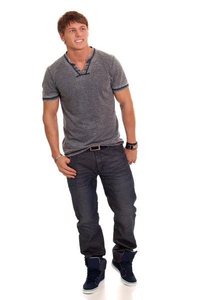 Man in jeans en t-shirt. studio opname over Wit. — Stockfoto