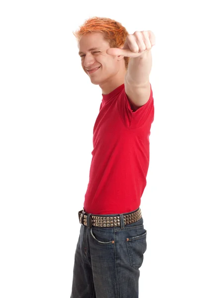 Young man in a red shirt and jeans. Studio shot over white. — Stock Photo, Image