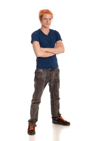 Junger Mann in blauem Hemd und Jeans. Studioaufnahme über Weiß. — Stockfoto