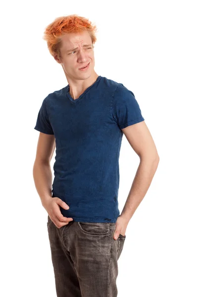 Jonge man in een blauw shirt en spijkerbroek. studio opname over Wit. — Stockfoto