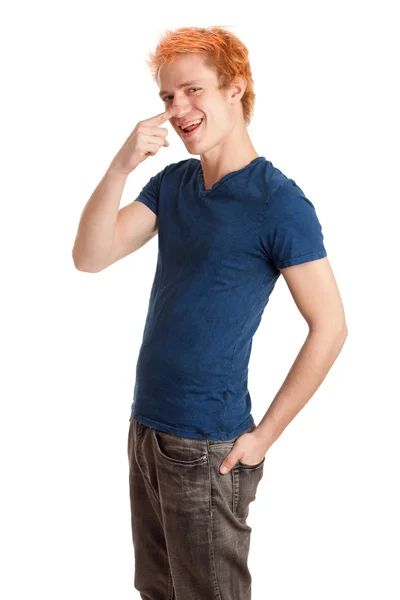 Young man in a blue shirt and jeans. Studio shot over white. — Stock Photo, Image