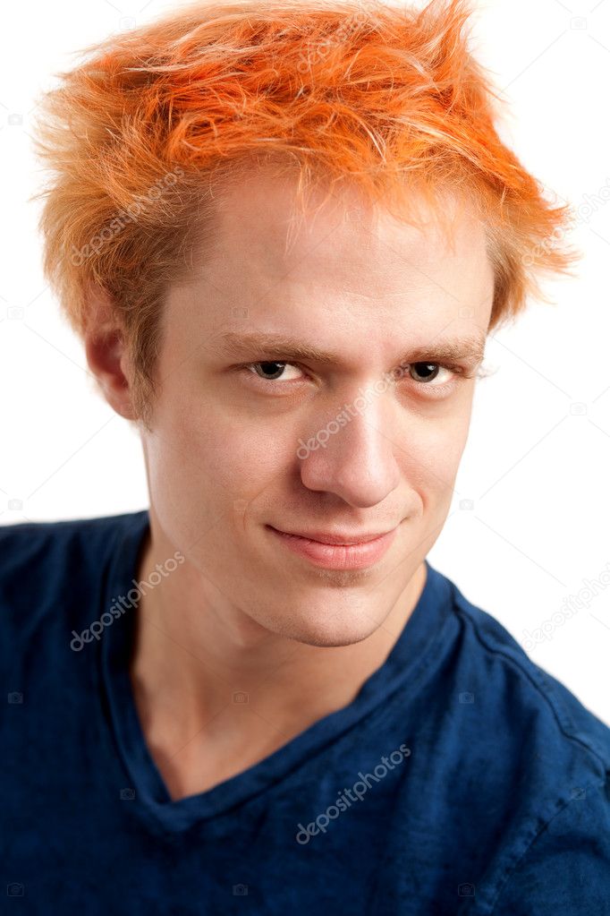 Young man with orange hair. Studio shot over white.