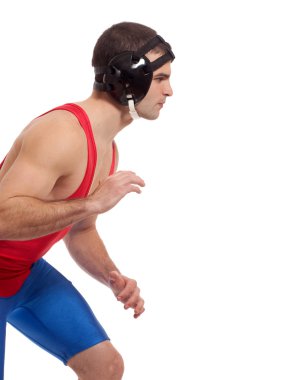 Young adult male wrestler. Studio shot over white. clipart