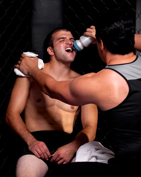 Mixed martial artist with corner man — Stock Photo, Image