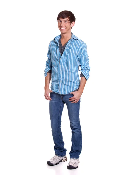 Genç adam mavi kot pantolon ve gömlek. Beyaz ateş studio. — Stok fotoğraf