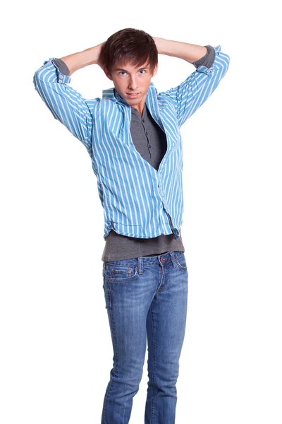 Young man in blue jeans and shirt. Studio shot over white. — Stock Photo, Image
