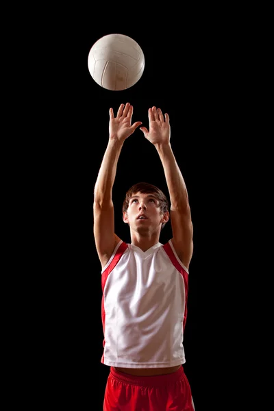 Männlicher Volleyballspieler. Studioaufnahme über Schwarz. — Stockfoto