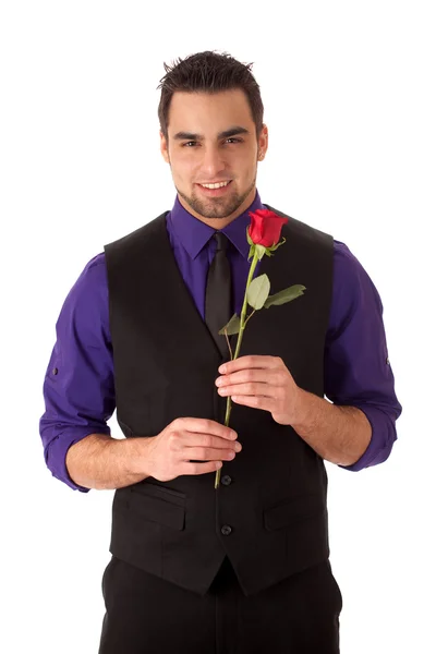 Хорошо одетый молодой человек с одной красной розой . — стоковое фото