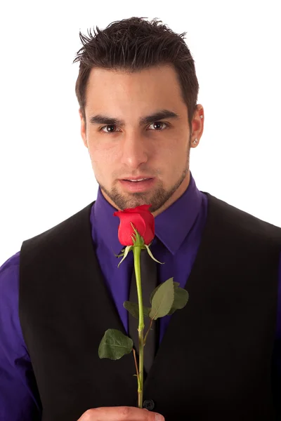 stock image Well dressed young man with a single red rose.