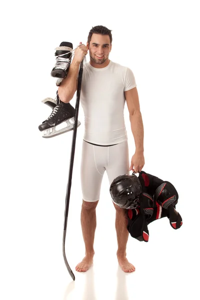 Jeune homme athlétique avec équipement de hockey sur glace . — Photo