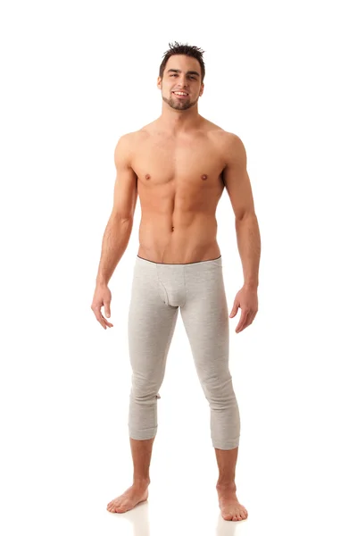 Aantrekkelijke man in lange ondergoed. studio opname over Wit. — Stockfoto