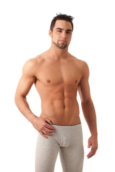 Attractive man in long underwear. Studio shot over white. — Stock Photo, Image