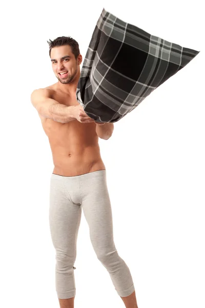 Attractive man with pillow. Studio shot over white. — Stock Photo, Image