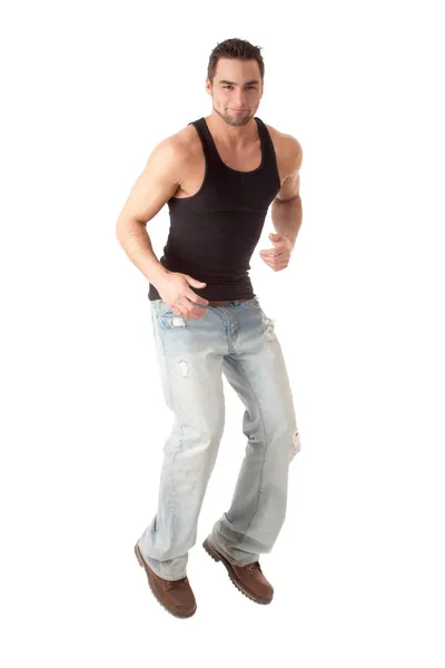 Hombre joven en jeans y camiseta negra. Estudio filmado sobre blanco . —  Fotos de Stock