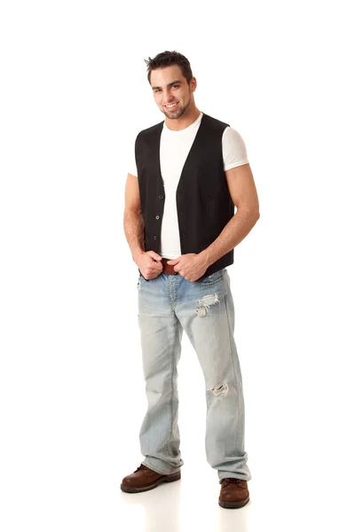 Young man in jeans and vest. Studio shot over white. — Stock Photo, Image