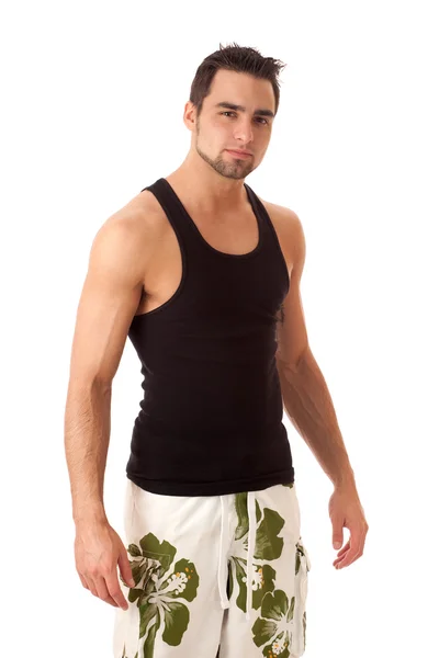Attraktiver junger Mann in kurzen Hosen. Studioaufnahme über Weiß. — Stockfoto