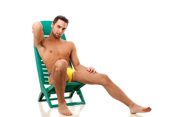 Attractive young man in swimsuit. Studio shot over white. — Stock Photo, Image