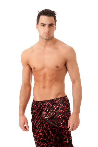 Man in heart patterned silk boxers. Studio shot over white. — Stock Photo, Image