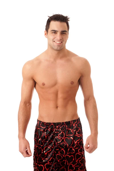 Man in heart patterned silk boxers. Studio shot over white. — Stock Photo, Image
