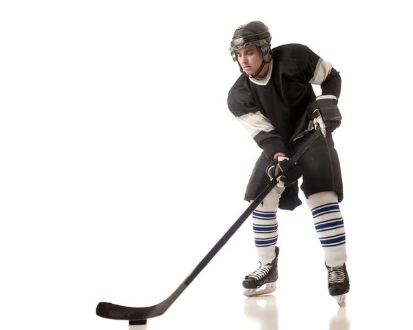 Ice hockey player. Studio shot over white. — Stock Photo, Image