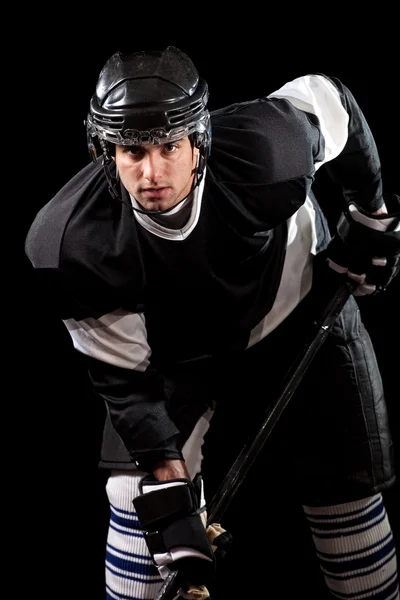 Ice hockey player. Studio shot over black. — Stock Photo, Image