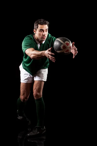 Male rugby player. Studio shot over black. — Stock Photo, Image