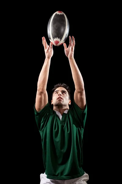 Male rugby player. Studio shot over black. — Stock Photo, Image