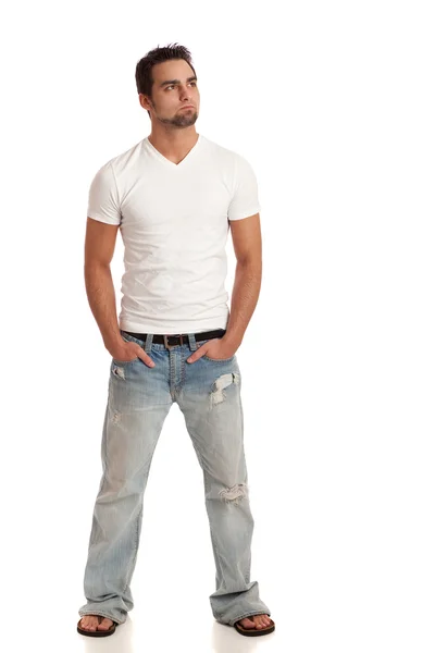 Un joven casual con jeans y camiseta. Estudio filmado sobre blanco . —  Fotos de Stock