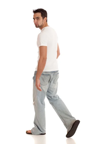 Casual jongeman in jeans en t-shirt. studio opname over Wit. — Stockfoto