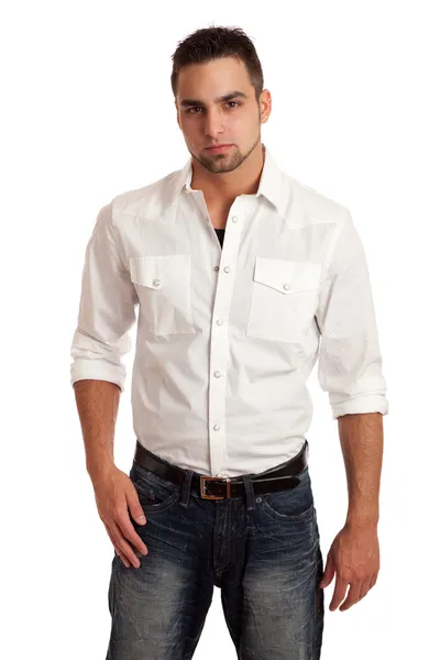 Ung man i skjorta och jeans. Studio skott över vita. — Stockfoto