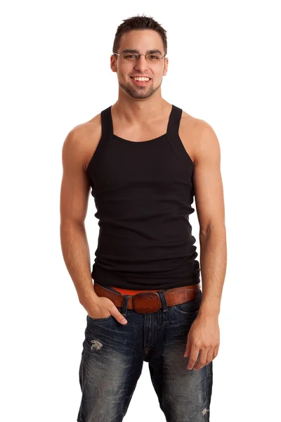 Junger Mann in Unterhemd und Jeans. Studioaufnahme über Weiß. — Stockfoto