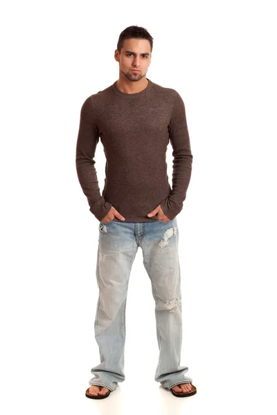 Молодой человек в свитере и джинсах. Студия над белым . — стоковое фото