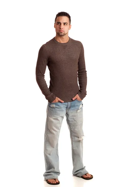 Молодой человек в свитере и джинсах. Студия над белым . — стоковое фото