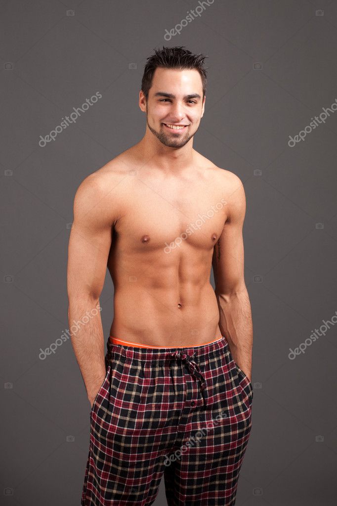 Attractive Man In Pajamas Studio Shot Over Grey Stock Photo By Nickp