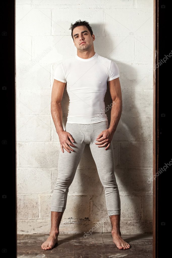 Man in long underwear and white compresion shirt.