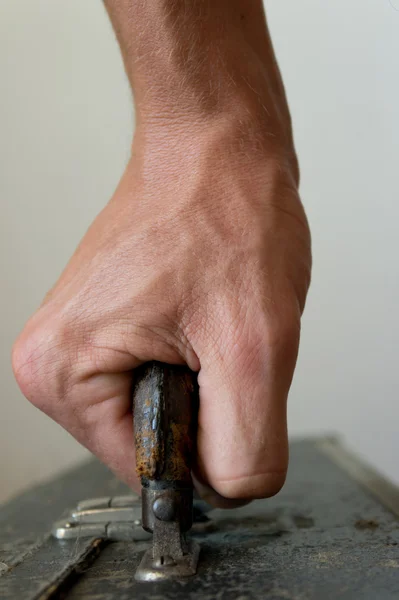 stock image Hand carrying a case