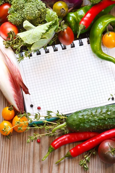 Notebook and vegetables. — Stock Photo, Image