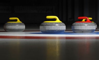 Four curling stones clipart