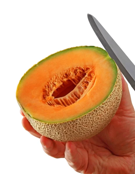 Half cantaloupe knife — Stock Photo, Image