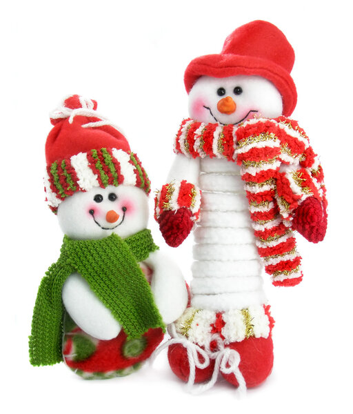 Two smiling snow man in the red caps and scarfs