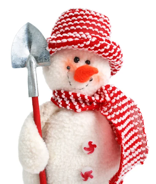 Sonriendo juguete muñeco de nieve con pala — Foto de Stock