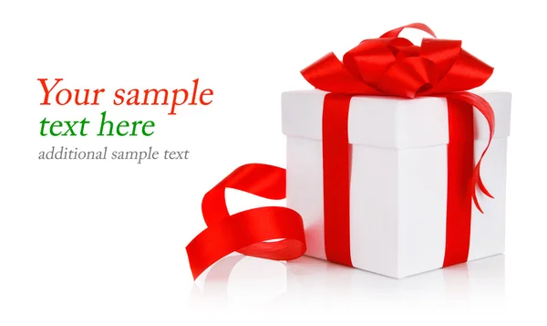 Gift with red bow and ribbon — Stock Photo, Image