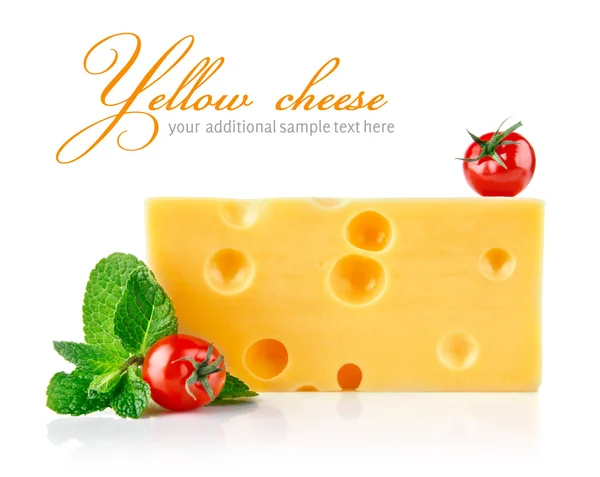 Yellow cheese with tomatoes and leaf — Stock Photo, Image