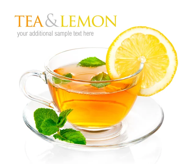 Tea in cup with leaf mint and lemon — Stock Photo, Image