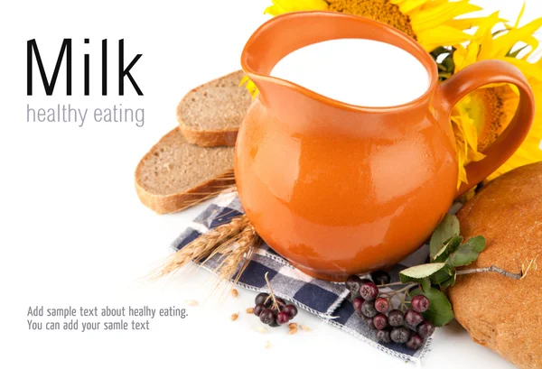 Jug with milk and bread — Stock Photo, Image