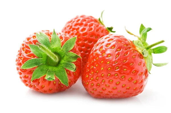 Fresh strawberry fruits with green leaves — Stock Photo, Image