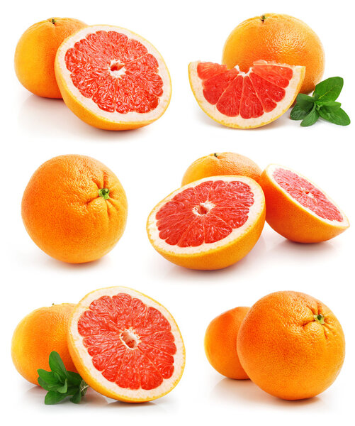 Set of grapefruit fruits with cut and green leaves